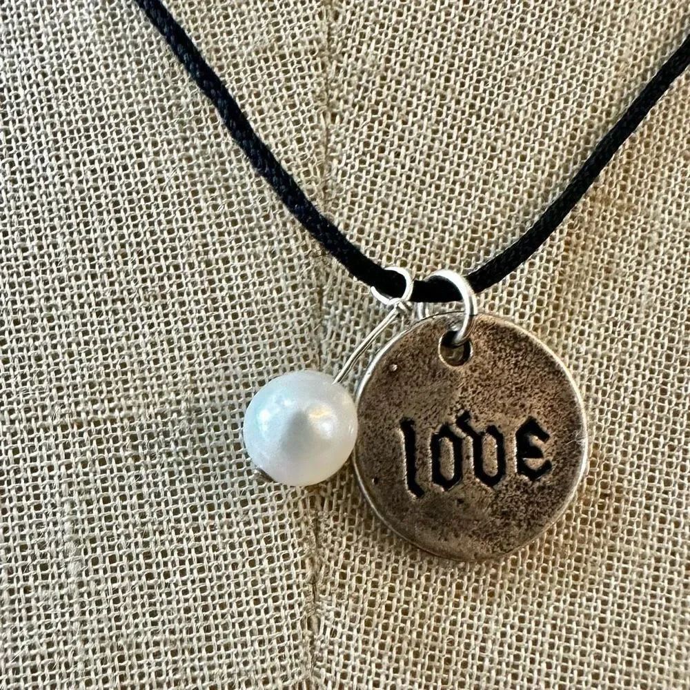 Sterling silver  love and pearl pendant on black cord